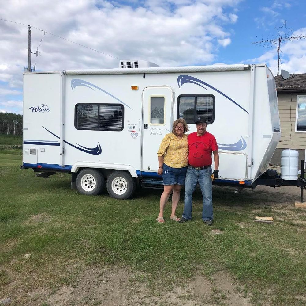 Wide Open Approvals customers with their new travel trailer