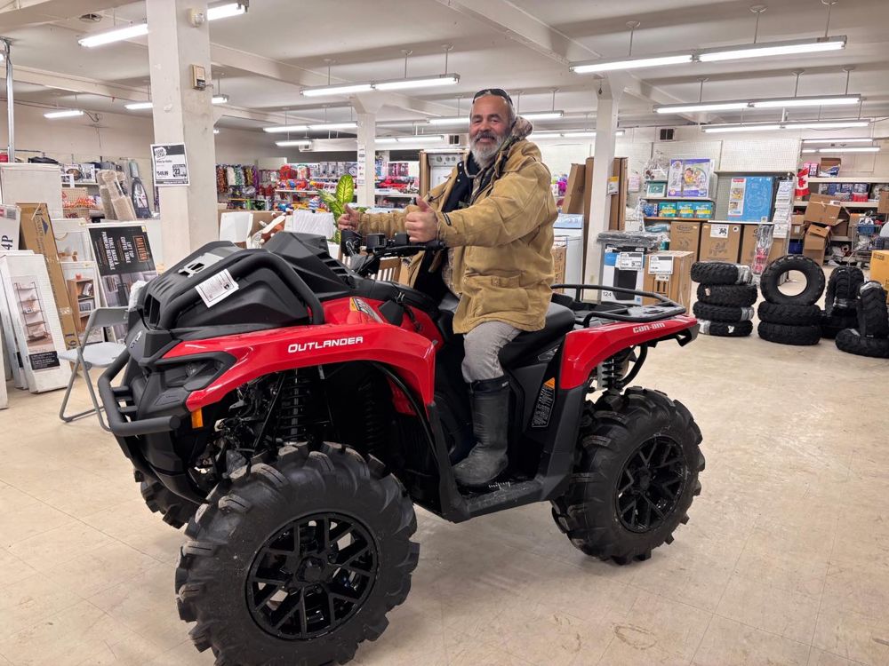 Customer on their new Can-Am Outlander ATV